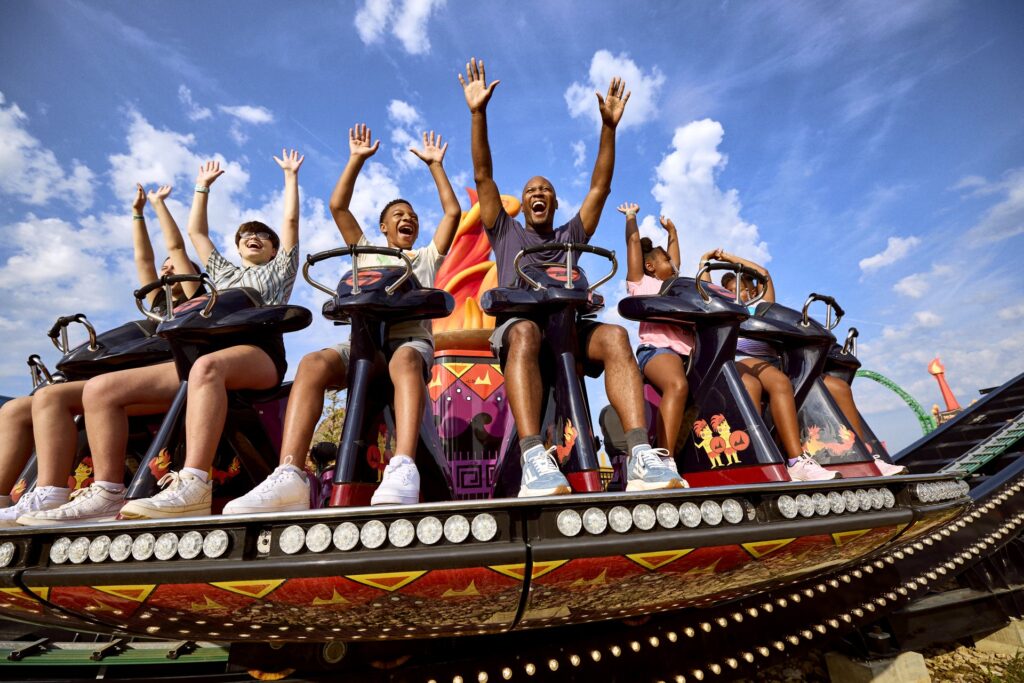 Father and son riding a spinning ride at Lost Island Themepark